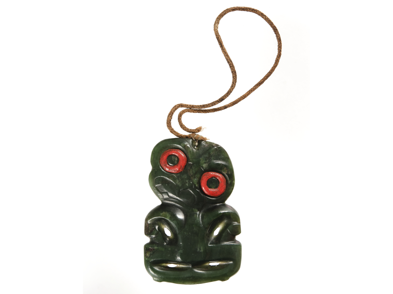 Article Image: Tiki pounamu with eyes made of sealing wax. Collected by Spencer George Perceval in Aotearoa (New Zealand). Museum of Archaeology & Anthropology, University of Cambridge, Acc. No. 1922.48. Photo: MAA.